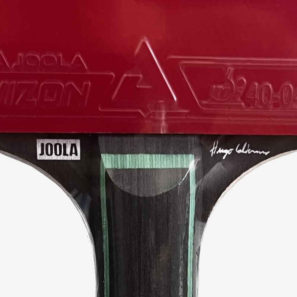 Detalhe da borracha Vizon Joola aprovada pela ITTF na raquete Hugo Calderano.